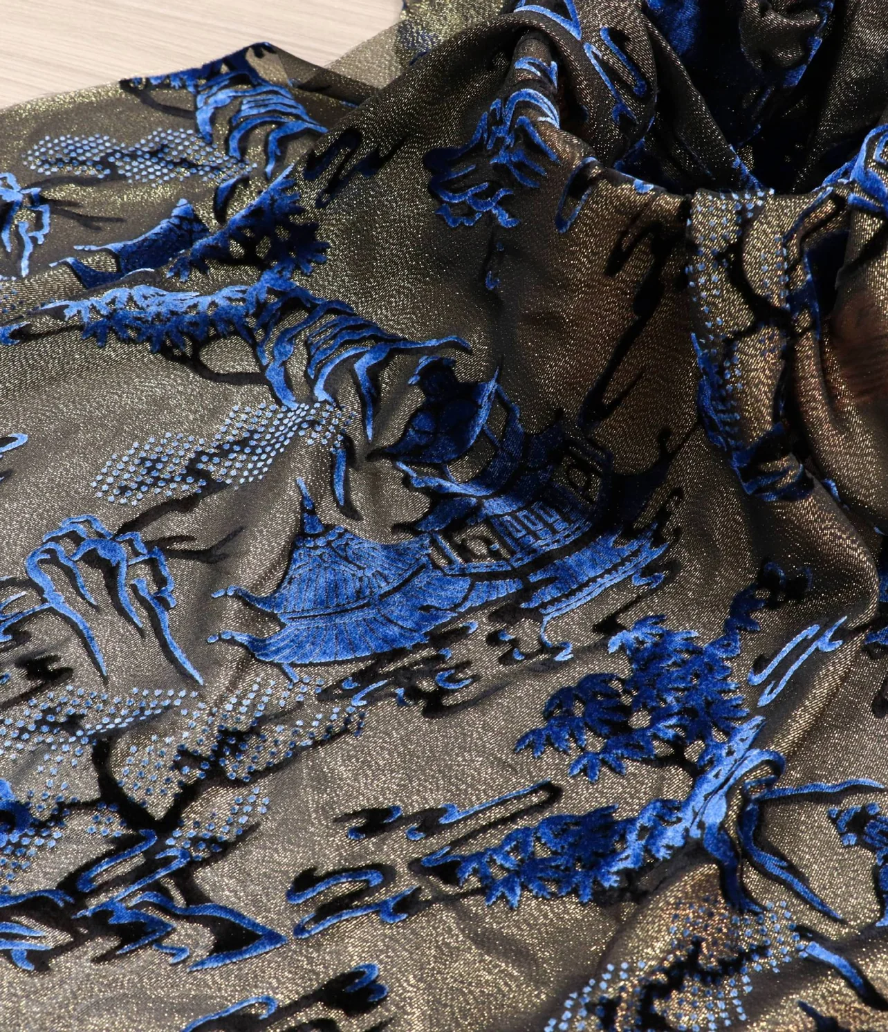 burnout velvet vivid peacock feather in electric blue on taupe