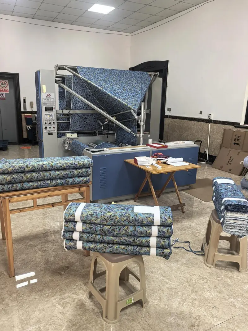 Finished folded fabric with MAISON KLEM branding