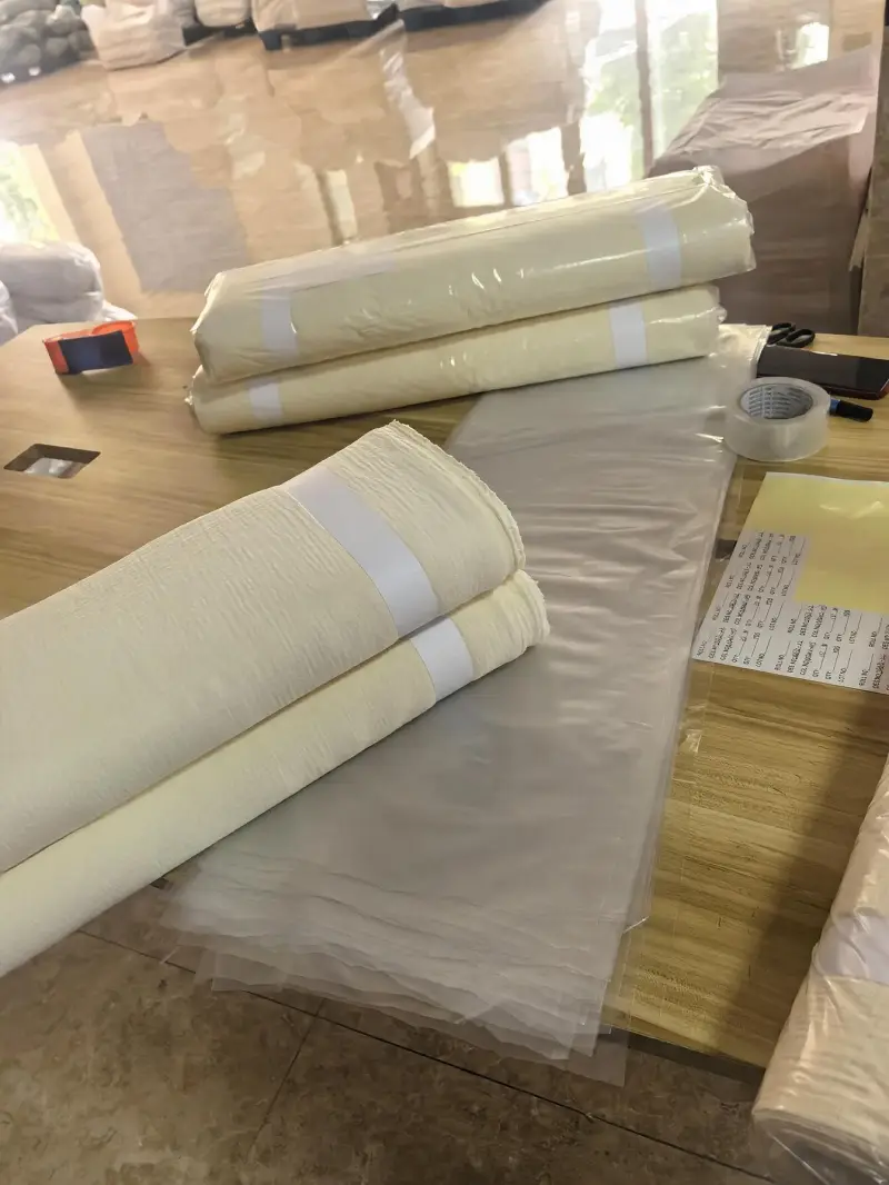 Rolled packing table with labeled fabric