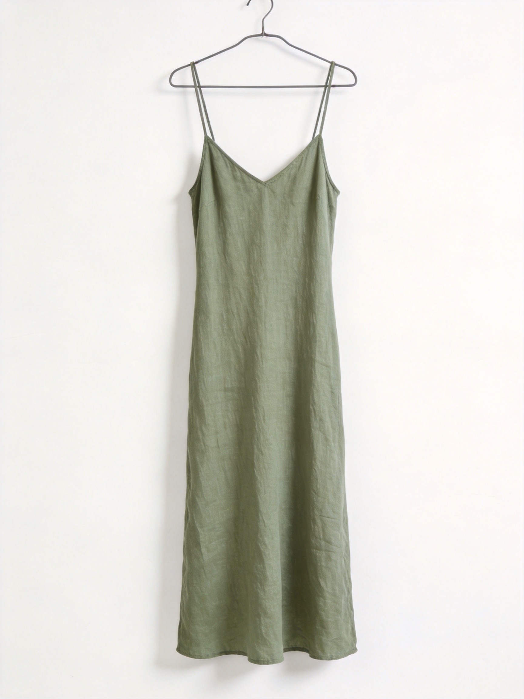 Woman wearing dusty sage green MJ 5506 slip dress